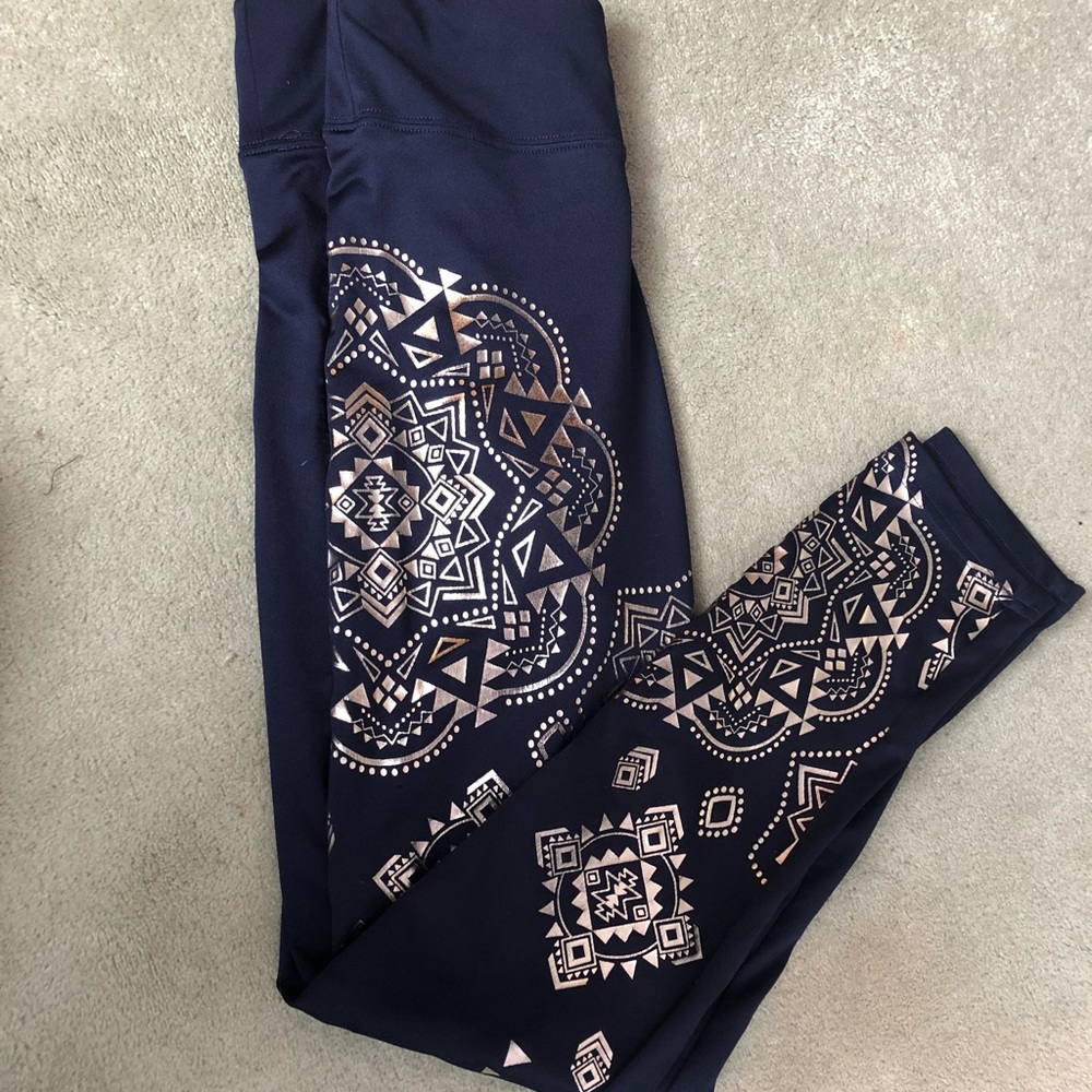 Justice high waisted leggings with gold designs.